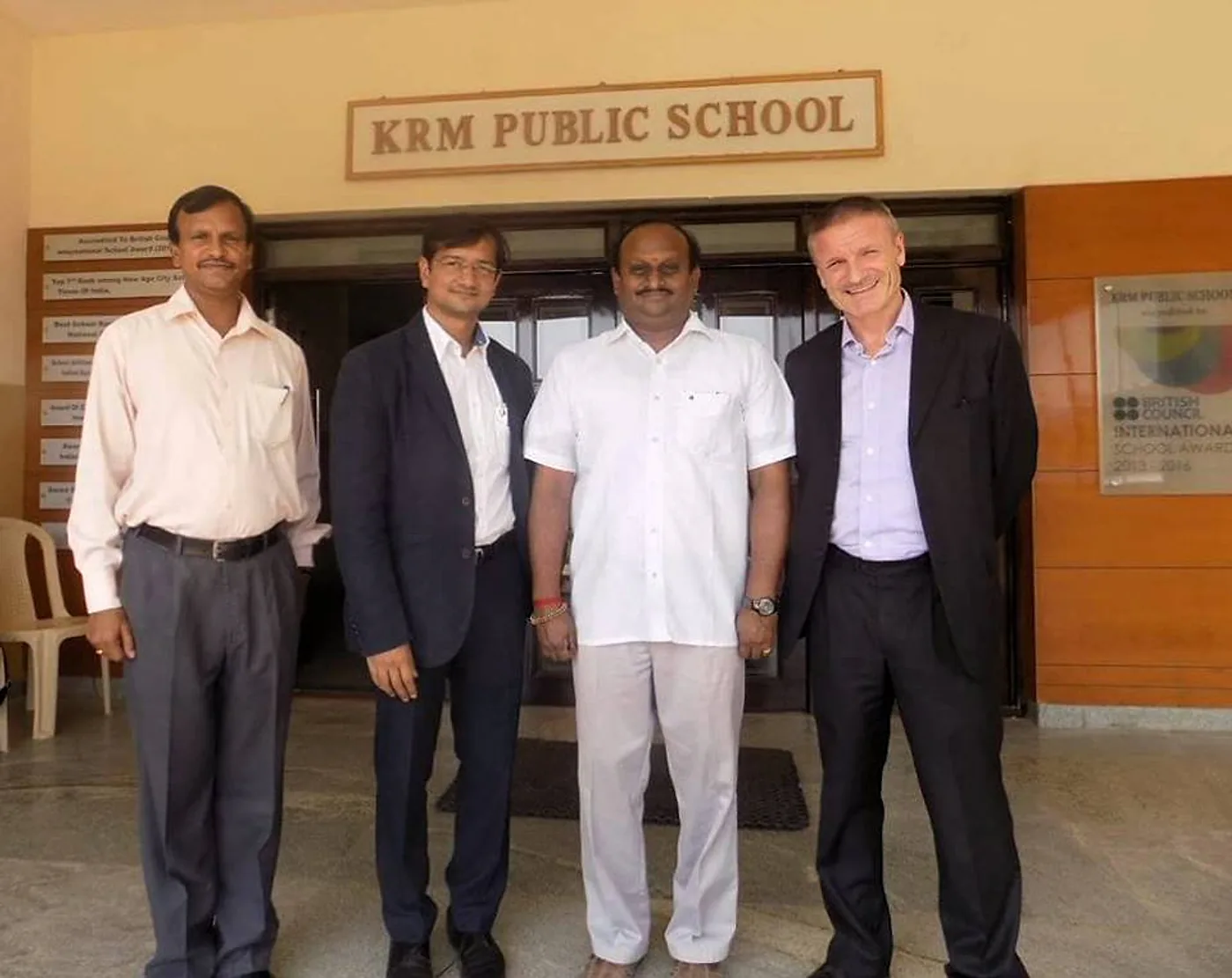 R.J. Bhuvanesh with visitors at the entrance of KRM Public School