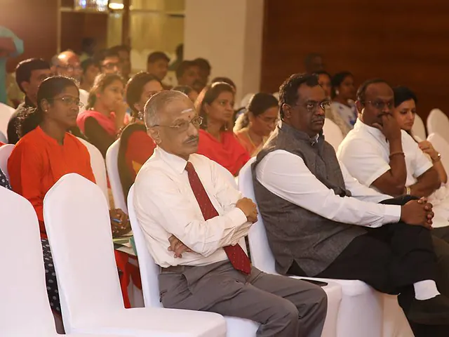 In the audience at a school function. A photograph of R.J. Bhuvanesh from the KRM Group of Schools archive